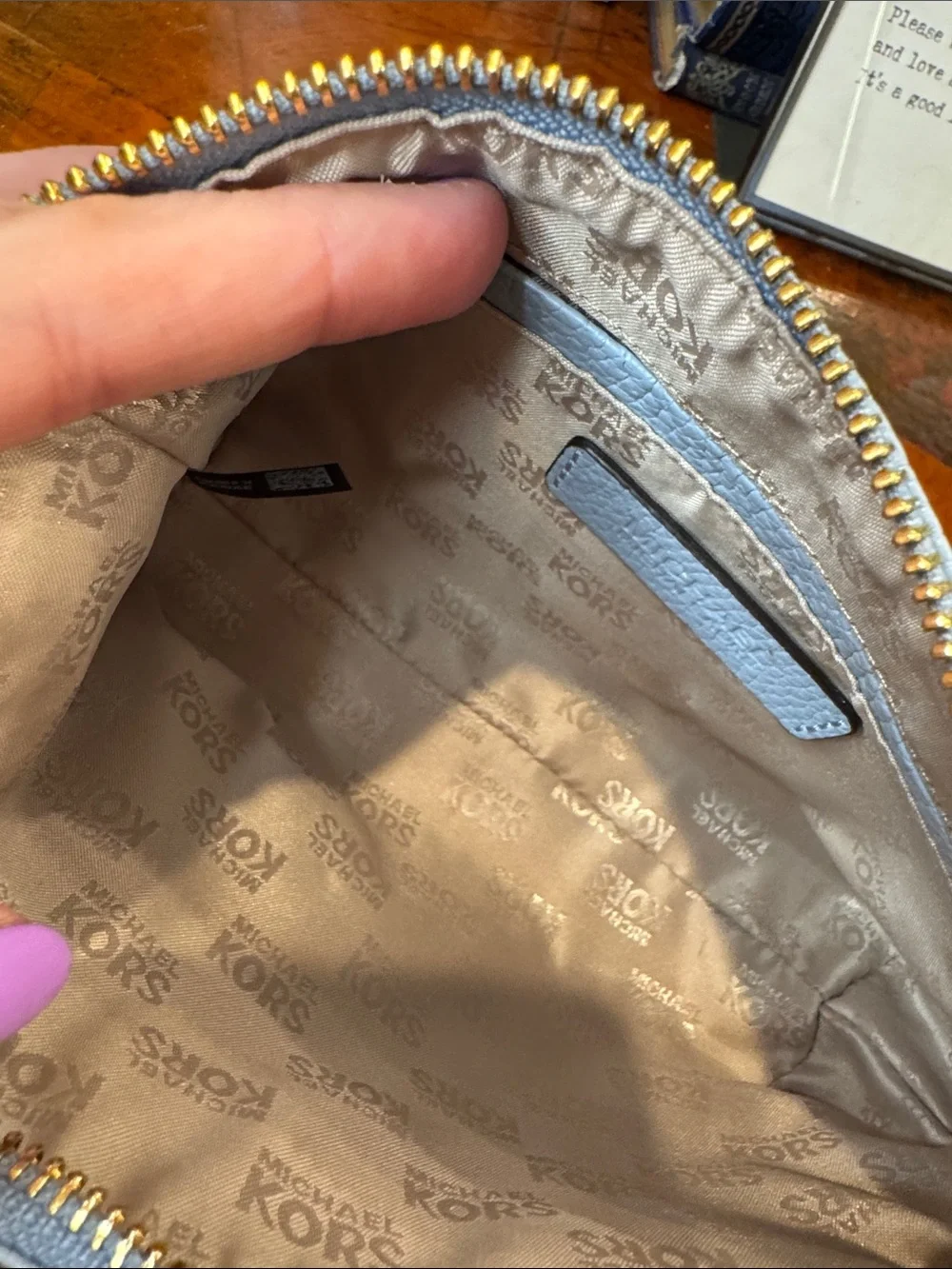 Michael Kors Light Blue Pebbled Leather Cosmetic Pouch with Gold MK Emblem